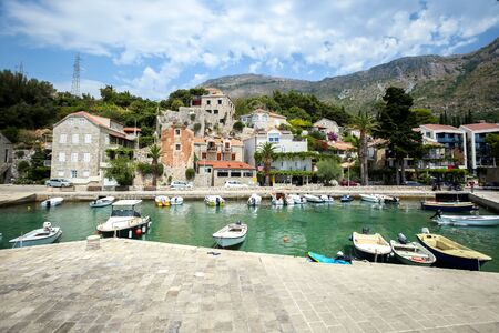 Boats anchored at pier at Dubrovnik riviera in Mlini, Croatia.の写真素材