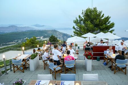 DUBROVNIK, CROATIA - JULY 21, 2017 : People dining in a restaurant at Srd hill in Dubrovnik, Croatia.のeditorial素材