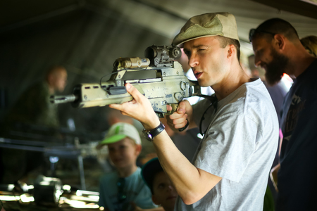 ZAGREB, CROATIA - MAY 28, 2017 : A man checking the Heckler and Koch g36 machine gun on the 26th anniversary of the formation of the Croatian Armed Forces on Lake Jarun in Zagreb, Croatia.のeditorial素材
