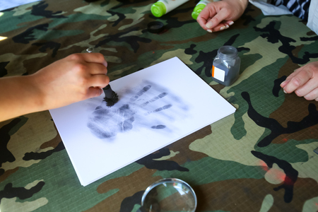 ZAGREB, CROATIA - MAY 28, 2017 : Forensic fingerprinting whole hand of visitors at the 26th anniversary of the formation of the Croatian Armed Forces on Lake Jarun in Zagreb, Croatia.のeditorial素材