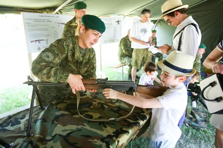 ZAGREB, CROATIA - MAY 28, 2017 : A soldier shows the boy machine gun M 72 exposed on the 26th...