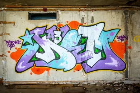 KUPARI, CROATIA - JULY 19, 2017 : The graffiti on the wall of an old ruined hotel in abandoned Yugoslavian military resort in Kupari, Croatia.のeditorial素材