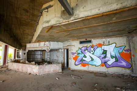 KUPARI, CROATIA - JULY 19, 2017 : The graffiti on the wall in the hallway of an old ruined hotel Goricina in abandoned Yugoslavian military resort in Kupari, Croatia.のeditorial素材