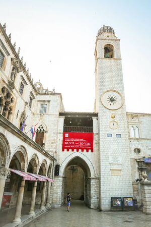DUBROVNIK, CROATIA - JULY 22, 2017 : The Sponza Palace and the city belfry in the main city street Stradun in Dubrovnik, Croatia.のeditorial素材