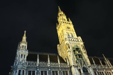 MUNICH, GERMANY - DECEMBER 11, 2017 : A low angle view of the New Town Hall on Marienplatz at night in Munich, Germany.のeditorial素材