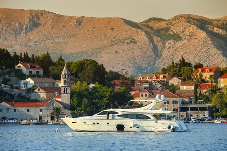 A view of a yacht anchored in front of seaside in Cavtat, Croatia.のeditorial素材