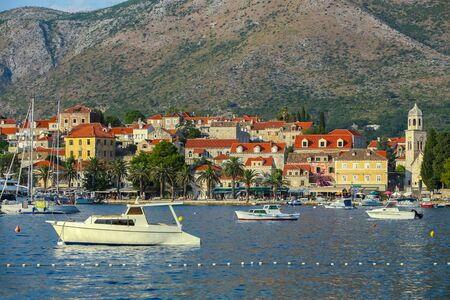 A view of boats anchored in front of seaside in Cavtat, Croatia.の写真素材