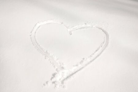 Heart shaped figure on the snow surface.の写真素材