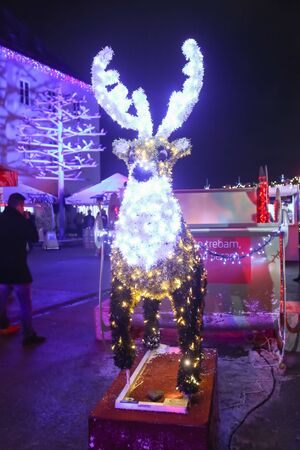 ZAGREB, CROATIA - DECEMBER 13th, 2017: Advent time in city center of Zagreb, Croatia. Illuminated reindeer with sledges set on the plateau of Klovicevi dvori gallery.のeditorial素材