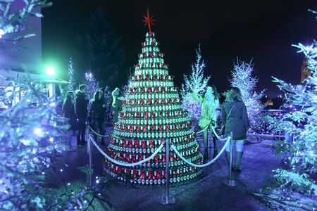 ZAGREB, CROATIA - DECEMBER 13th, 2017: Advent time in city center of Zagreb, Croatia. People sightseeing Christmas tree made from beer cans on the plateau of Klovicevi dvori gallery.のeditorial素材