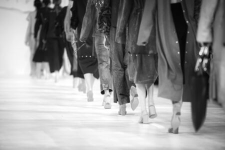 Fashion Show, Catwalk Runway Show Event. Detail of lined up rear view, fashion models. Black and white.の写真素材