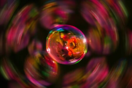 Abstract image of soap bubbles from the bubble blower in dark.の写真素材
