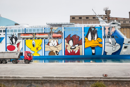 LA SPEZIA, ITALY : JUNE 15th, 2005 : Moby Lines Moby Wonder ferry ship with characters of Looney Tunes drawn at the side of the ship, docked in a port of La Spezia, Italy.のeditorial素材