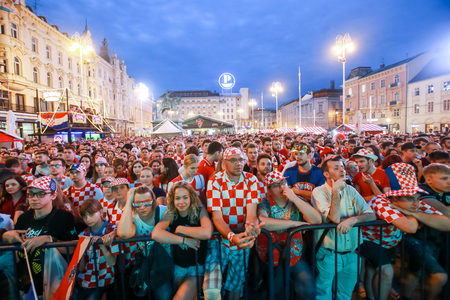 ZAGREB, CROATIA - JUNE 16TH, 2018 : Croatian football fans watching on the big screen football game of Croatia vs Nigeria on Fifa World cup 2018 on Ban Jelacic Square in Zagreb, Croatia.のeditorial素材