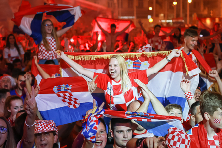ZAGREB, CROATIA - JULY 7TH, 2018 : Croatian football fans celebrate Croatian quarter final victory over Russia on Fifa World cup 2018 on Ban Jelacic Square in Zagreb, Croatia.のeditorial素材