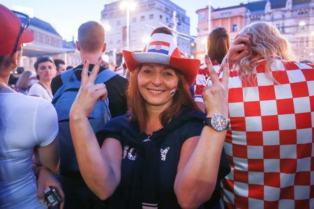 ZAGREB, CROATIA - JULY 7TH, 2018 : Croatian woman football fan during football game of quarterfinal of Croatia vs Russia on Fifa World cup 2018 on Ban Jelacic Square in Zagreb, Croatia.のeditorial素材