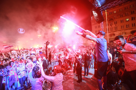 ZAGREB, CROATIA - JULY 7TH, 2018 : Croatian football fans celebrate Croatian quarter final victory over Russia on Fifa World cup 2018 on Ban Jelacic Square in Zagreb, Croatia.のeditorial素材