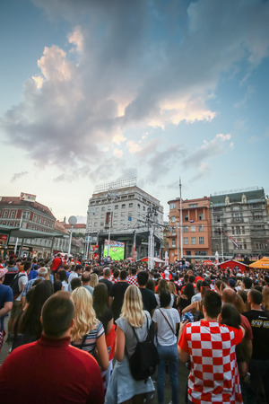 ZAGREB, CROATIA - JULY 7TH, 2018 : Croatian football fans watching football game of quarterfinal of Croatia vs Russia on Fifa World cup 2018 on the big screen on Ban Jelacic Square in Zagreb, Croatia.のeditorial素材