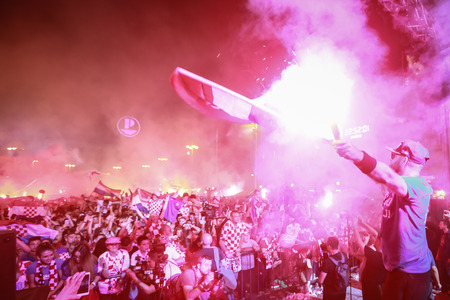 ZAGREB, CROATIA - JULY 7TH, 2018 : Croatian football fans celebrate Croatian quarter final victory over Russia on Fifa World cup 2018 on Ban Jelacic Square in Zagreb, Croatia.のeditorial素材