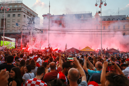 ZAGREB, CROATIA - JULY 7TH, 2018 : Croatian football fans celebrate first Croatian goal of football game quarter final of Croatia vs Russia on Fifa World cup 2018 on Ban Jelacic Square in Zagreb, Croatia.のeditorial素材