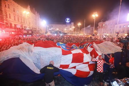 ZAGREB, CROATIA - JULY 11, 2018 : Croatian football fans celebrating victory of 2:1 Croatia vs England in semifinales Fifa World cup 2018 on Ban Jelacic Square in Zagreb, Croatia.のeditorial素材