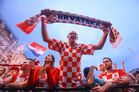ZAGREB, CROATIA - JULY 11, 2018 : Croatian football fans celebrating victory of 2:1 Croatia vs England in semifinales Fifa World cup 2018 on Ban Jelacic Square in Zagreb, Croatia.のeditorial素材