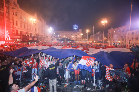 ZAGREB, CROATIA - JULY 11, 2018 : Croatian football fans celebrating victory of 2:1 Croatia vs England in semifinales Fifa World cup 2018 on Ban Jelacic Square in Zagreb, Croatia.のeditorial素材