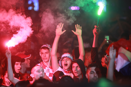 ZAGREB, CROATIA - JULY 11, 2018 : Croatian football fans celebrating victory of 2:1 Croatia vs England in semifinales Fifa World cup 2018 on Ban Jelacic Square in Zagreb, Croatia.のeditorial素材