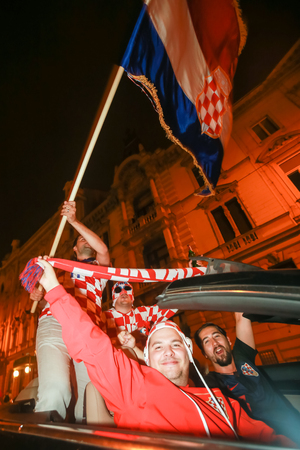 ZAGREB, CROATIA - JULY 11, 2018 : Croatian football fans celebrating victory of 2:1 Croatia vs England in semi finales Fifa World cup 2018 on the streets of Zagreb, Croatia.のeditorial素材