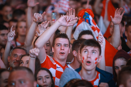 ZAGREB, CROATIA - JULY 11, 2018 : Croatian football fans celebrating victory of 2:1 Croatia vs England in semi finales Fifa World cup 2018 on Ban Jelacic Square in Zagreb, Croatia.のeditorial素材