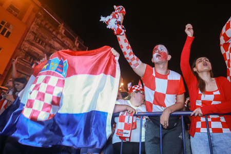 ZAGREB, CROATIA - JULY 11, 2018 : Croatian football fans celebrating victory of 2:1 Croatia vs England in semi finales Fifa World cup 2018 on Ban Jelacic Square in Zagreb, Croatia.のeditorial素材