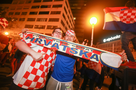 ZAGREB, CROATIA - JULY 11, 2018 : Croatian football fans celebrating victory of 2:1 Croatia vs England in semi finales Fifa World cup 2018 on Ban Jelacic Square in Zagreb, Croatia.のeditorial素材