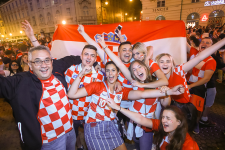 ZAGREB, CROATIA - JULY 11, 2018 : Croatian football fans celebrating victory of 2:1 Croatia vs England in semi finales Fifa World cup 2018 on Ban Jelacic Square in Zagreb, Croatia.のeditorial素材