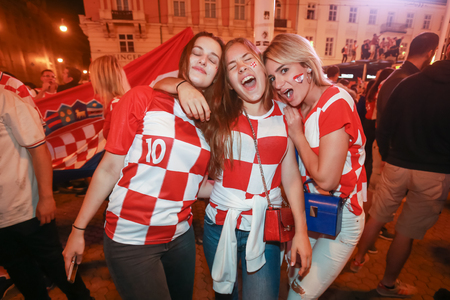 ZAGREB, CROATIA - JULY 11, 2018 : Croatian football fans celebrating victory of 2:1 Croatia vs England in semi finales Fifa World cup 2018 on Ban Jelacic Square in Zagreb, Croatia.のeditorial素材