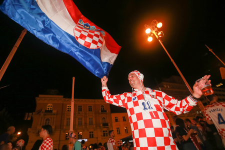 ZAGREB, CROATIA - JULY 11, 2018 : Croatian football fans celebrating victory of 2:1 Croatia vs England in semi finales Fifa World cup 2018 on Ban Jelacic Square in Zagreb, Croatia.のeditorial素材