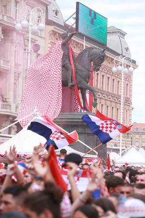 ZAGREB, CROATIA - JULY 15, 2018 : Croatian football fans dressed up statue of Ban Jelacic during the World Cup 2018 FIFA, Final game, France vs. Croatia on Ban Jelacic Square in Zagreb, Croatia.のeditorial素材