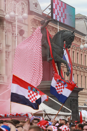 ZAGREB, CROATIA - JULY 15, 2018 : Croatian football fans dressed up statue of Ban Jelacic during the World Cup 2018 FIFA, Final game, France vs. Croatia on Ban Jelacic Square in Zagreb, Croatia.のeditorial素材