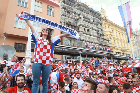 ZAGREB, CROATIA - JULY 15, 2018 : Croatian football woman fan holds sign saying So many of us, during celebration of second place on the World Cup 2018 FIFA on Ban Jelacic Square in Zagreb, Croatia.のeditorial素材