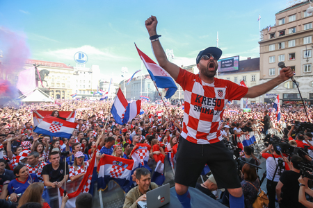 ZAGREB, CROATIA - JULY 15, 2018 : Croatian football fans support national team before and during the World Cup 2018 FIFA, Final game, France vs. Croatia on Ban Jelacic Square in Zagreb, Croatia.のeditorial素材