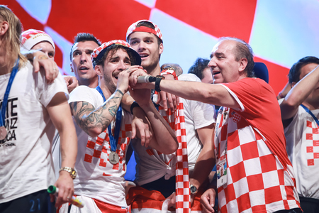 ZAGREB, CROATIA - JULY 16, 2018 : Croatia National Football Team welcome home celebration. Sime Vrsaljko, Duje Caleta Car singing together with singer Mladen Grdovic on Ban Jelacic Square.のeditorial素材