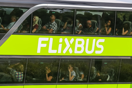 Zagreb, Croatia - August 11th,2018 :Green bus of Flixbus company stuck in traffic jam due to the large number of tourists going to the sea coast of Croatia in the Lucko highway toll in Zagreb,Croatia.のeditorial素材