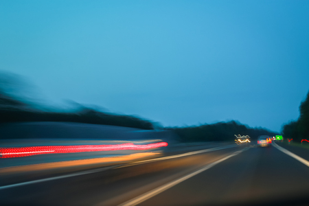 Abstract lines of traffic on highway at sunset.の写真素材