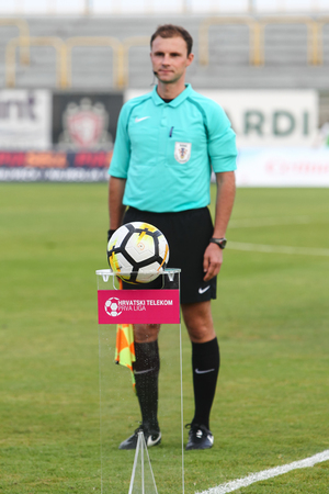 Velika Gorica, Croatia - 25th, August 2018 : The first football league Hrvatski Telekom, football game between Hnk Gorica and Rudes on Gorica stadium. Ball on the stand with referee in the background.のeditorial素材