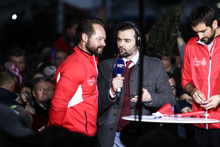 ZAGREB, CROATIA - NOVEMBER 26, 2018 : Croatia National Tennis Team welcome home celebration on the Ban Jelacic Square. Zeljko Krajan, Marin Cilic and Borna Coric giving an interview to Tv crew.のeditorial素材