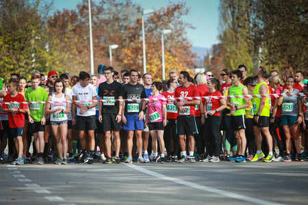 Zagreb, Croatia - November 11, 2018 : A front view of people standing lined up at the start position at the 32. Ivan Starek half marathon event at lake Jarun in Zagreb, Croatia.のeditorial素材