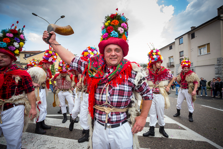 Matulji, Croatia - 3rd February, 2019 : Traditional carnival parade of bellringers with big cattle bells passing thru the street of Matulji, during the carnival procession.のeditorial素材