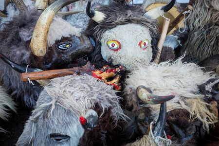 Group of masks from the Halubajski bellringers on the floor after carnival procession in Matulji,...