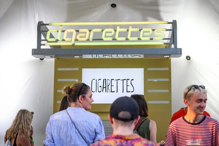Zagreb, Croatia - 24th June, 2019 : Atmosphere during the 14th INmusic festival located on the lake Jarun in Zagreb, Croatia. Stand with cigarettes on the festival.のeditorial素材