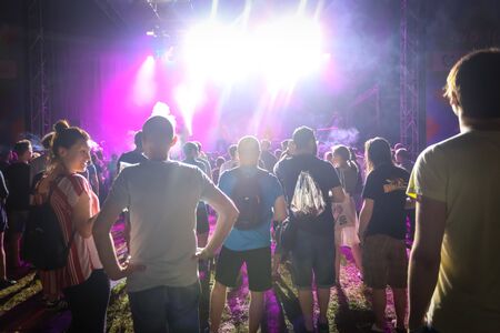 Zagreb, Croatia - 26th June, 2019 : Visitors of 3rd day of the 14th INmusic festival located on the lake Jarun in Zagreb, Croatia. Rear view of people during the concert.のeditorial素材