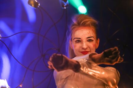 Brezje, Croatia - 19th July, 2019 : A woman juggling with a fire on the stage on the Forestland, ultimate forest electronic music festival located in Brezje, Croatia.のeditorial素材